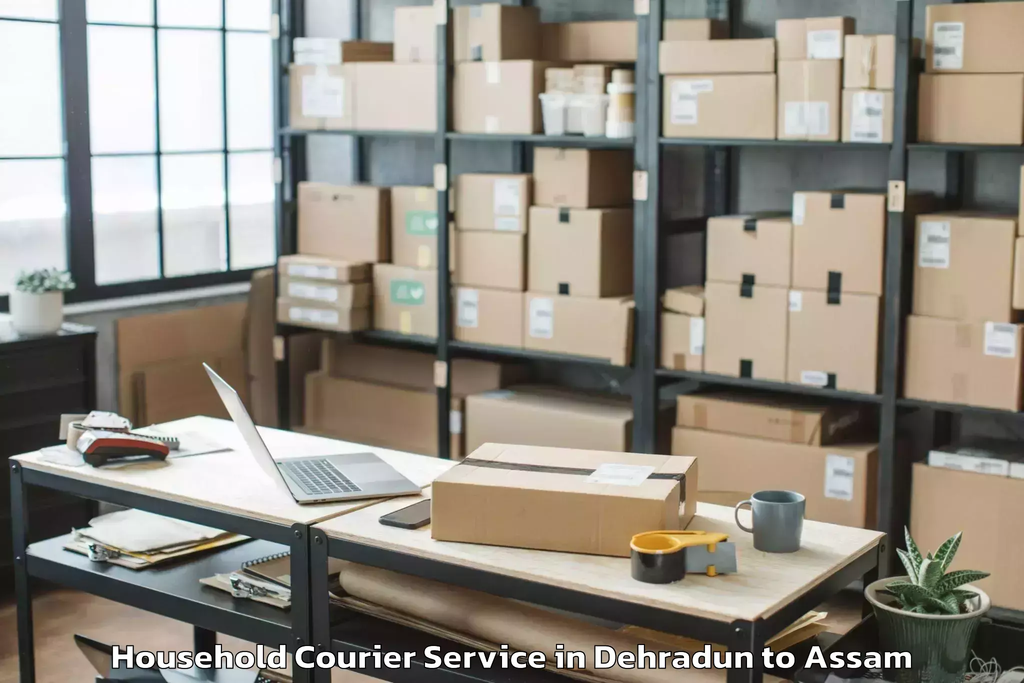 Book Your Dehradun to Makum Household Courier Today